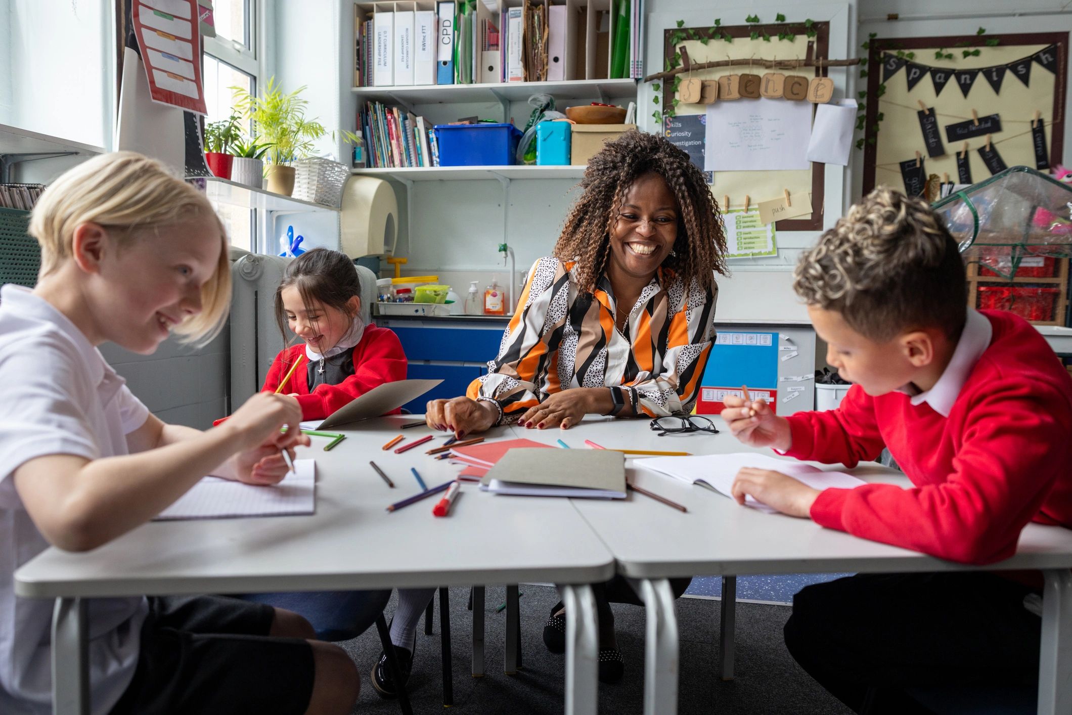 Teacher and children learning together in a classroom
