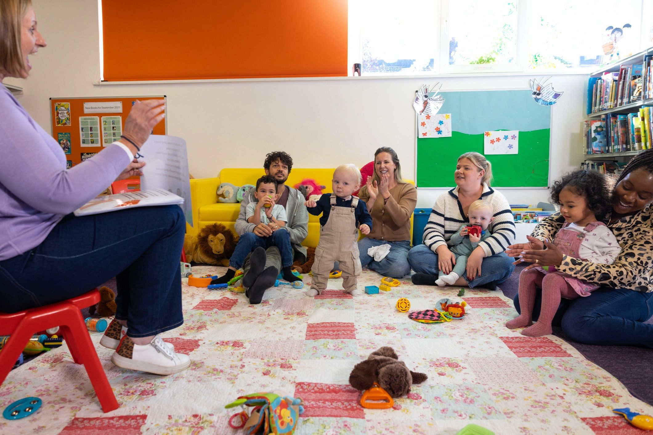 Families and children in a welcoming group setting