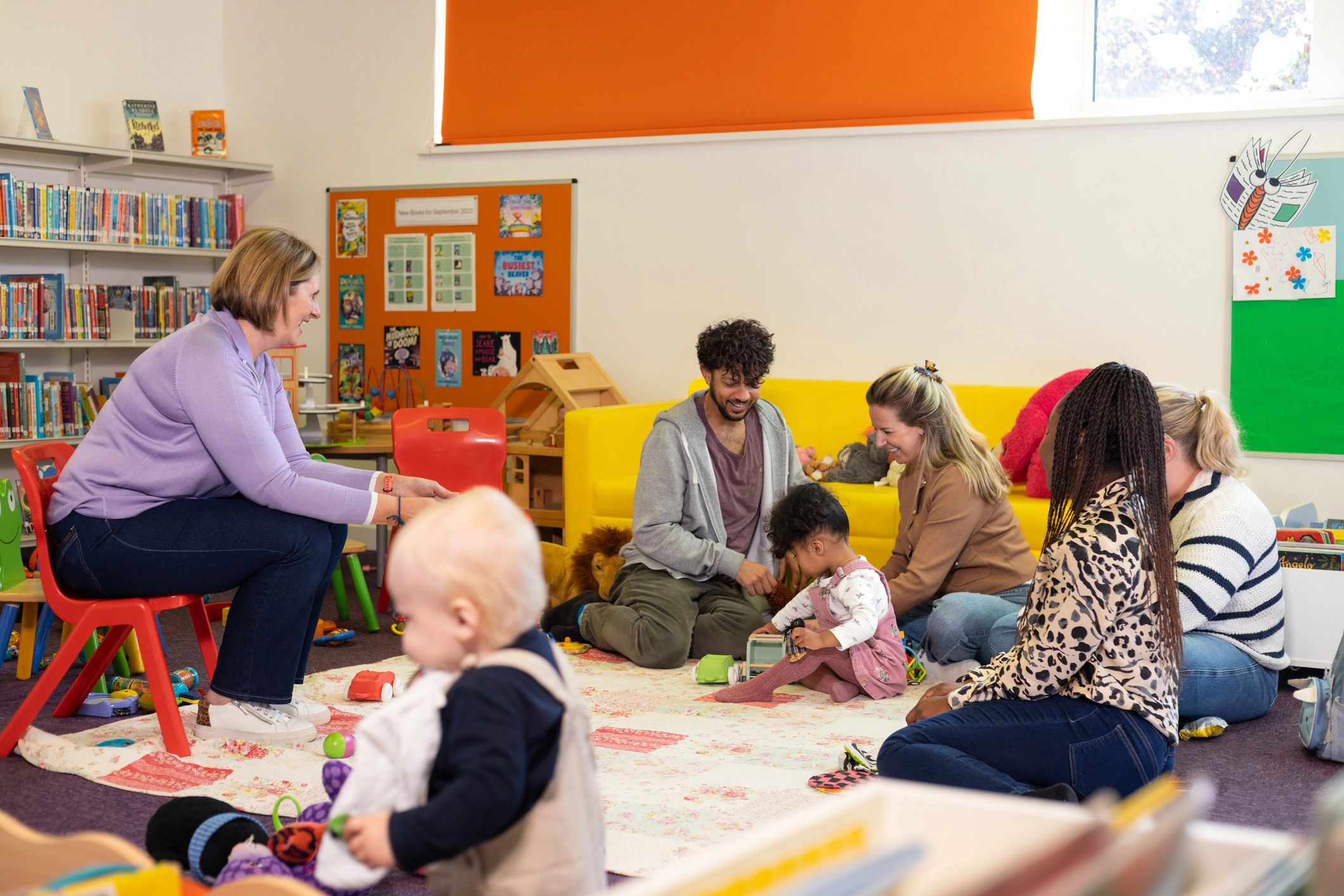 Group story time with children and caregiver