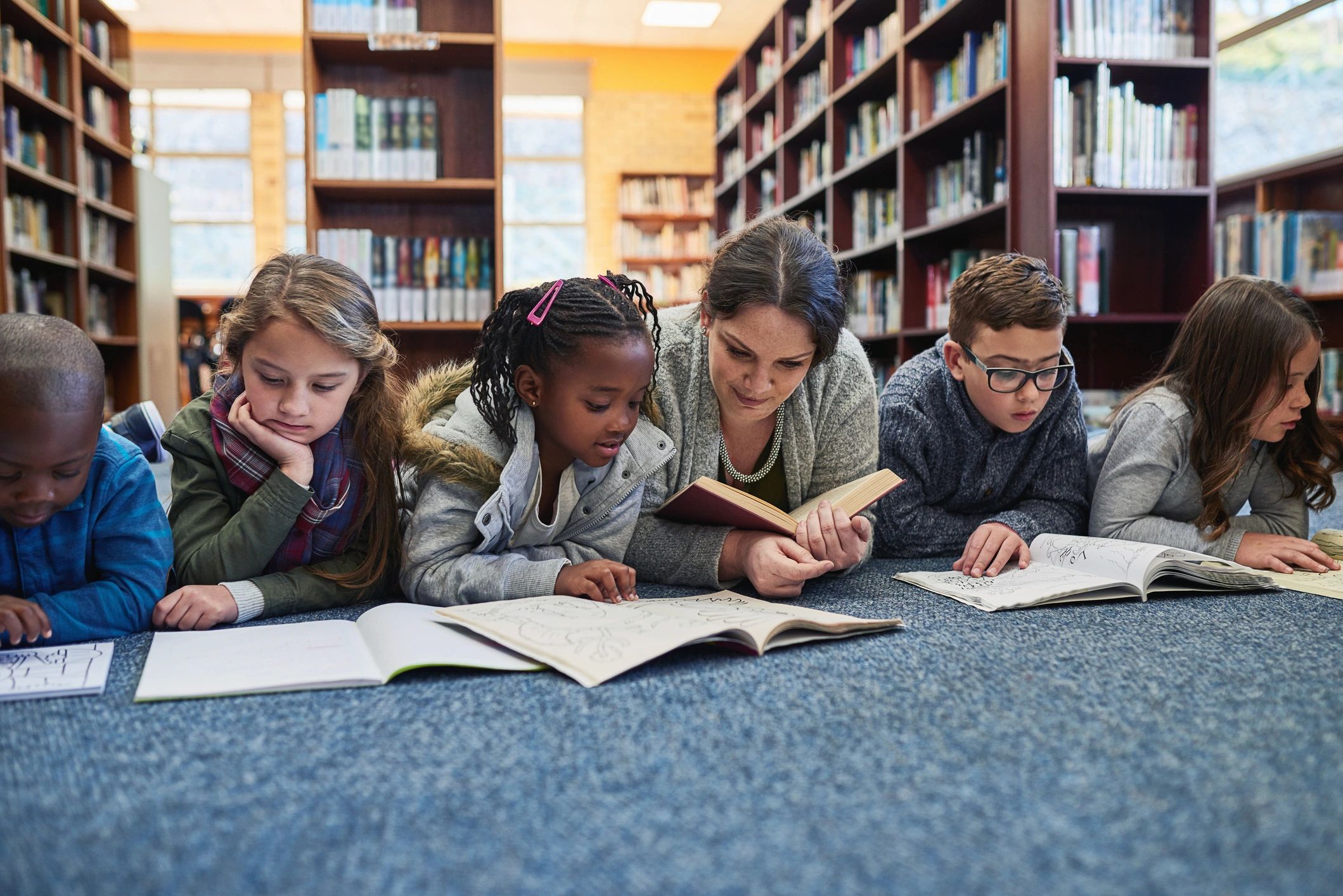 Children and teacher enjoying story time together